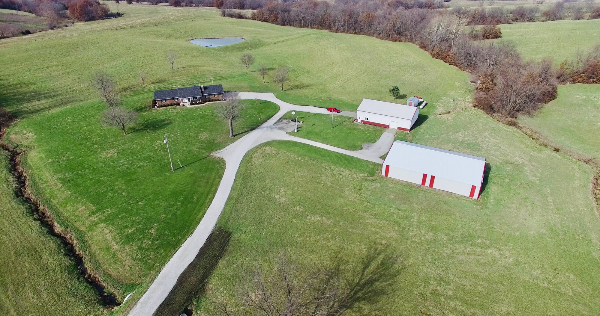 Aerial view showing a rural property and surrounding land